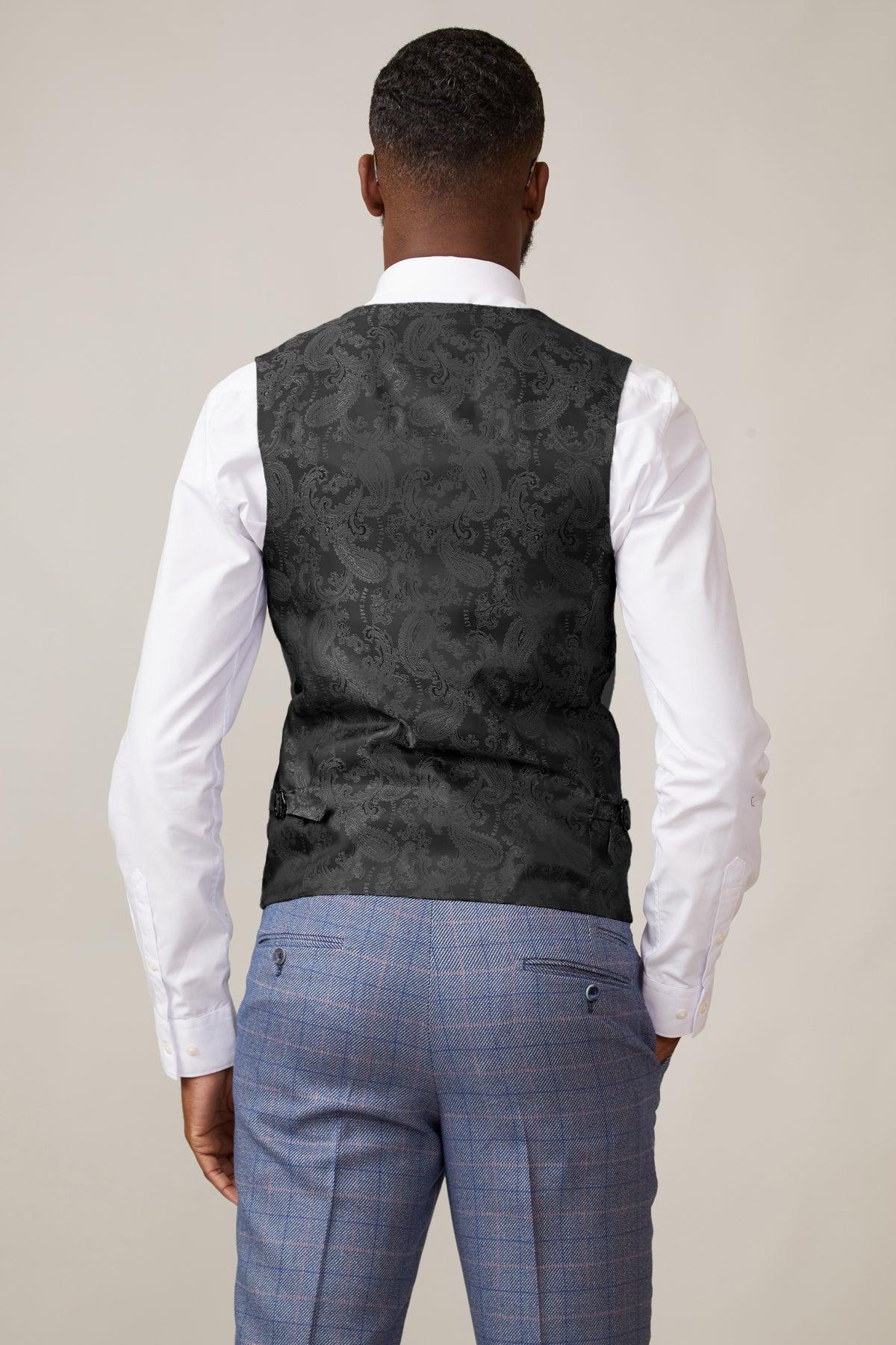 A man is shown from behind wearing a white dress shirt, a marcdarcy KELVIN silver single-breasted waistcoat, and light blue plaid trousers against a simple neutral background.