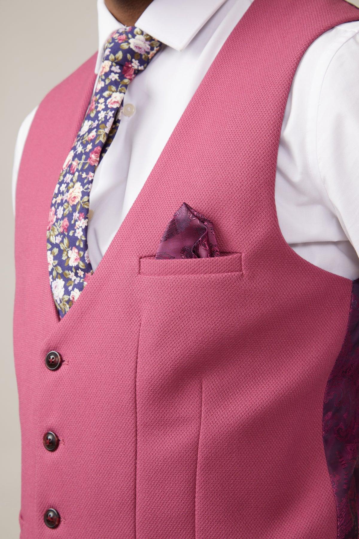 Man wearing the marcdarcy KELVIN - Berry Single Breasted Waistcoat, a white shirt, floral tie, and a purple patterned pocket square.