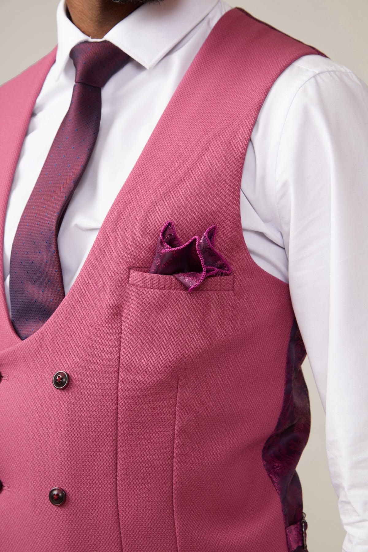A man in a marcdarcy KELVIN - Berry Double Breasted Waistcoat with paisley lining, styled with a white shirt, maroon polka dot tie, and purple pocket square, shown from chest to neck.