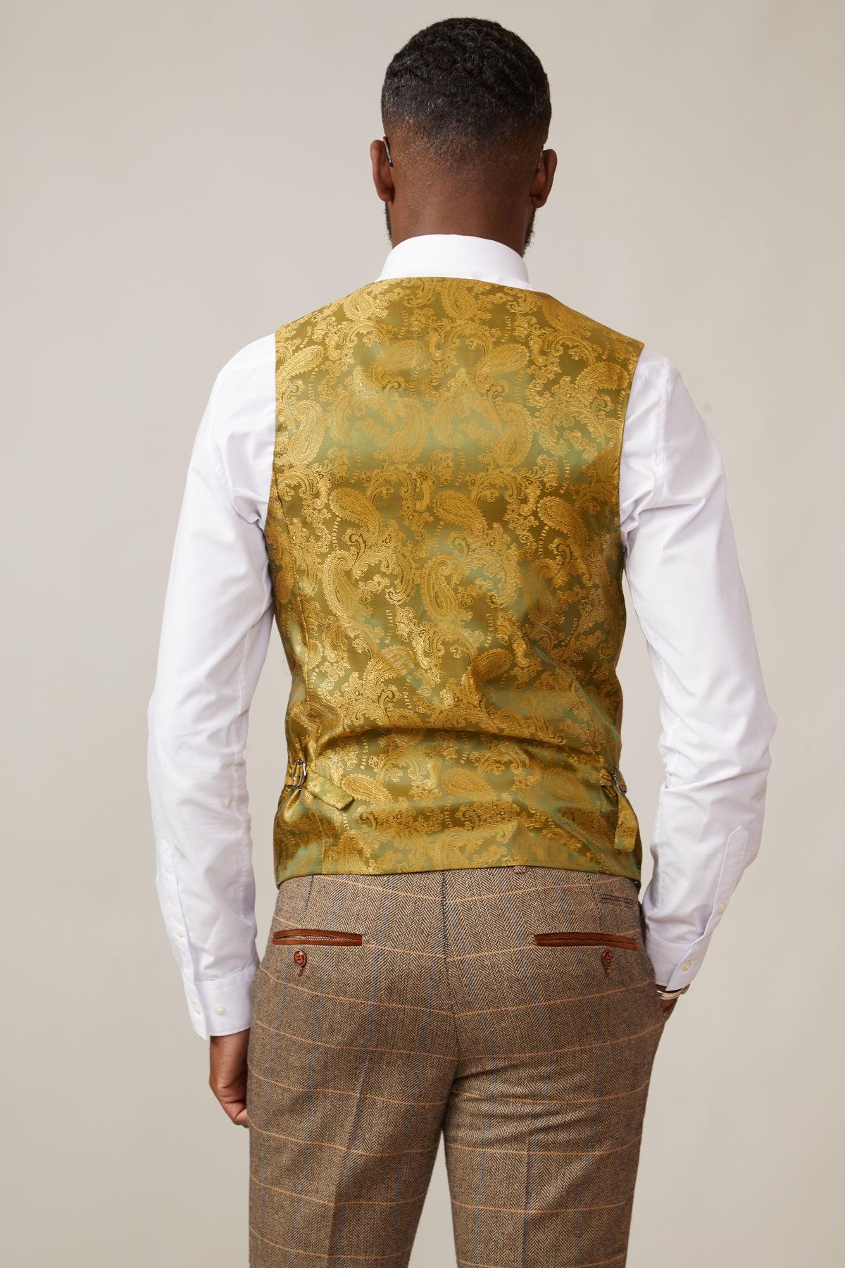 A man is seen from behind wearing a white shirt, brown plaid trousers, and the marcdarcy KELVIN Oak Double Breasted Waistcoat.