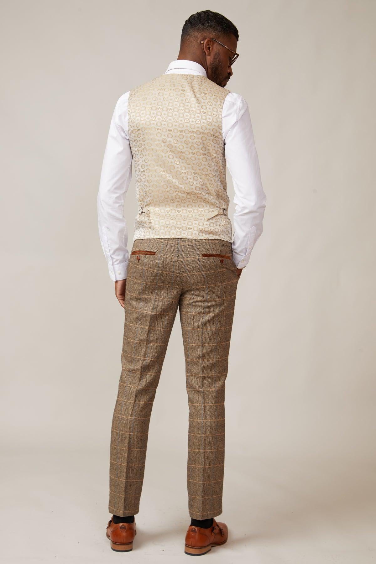 Back view of a man wearing the marcdarcy TED tan tweed check suit with Kelvin cream waistcoat—a refined country-style wedding look.