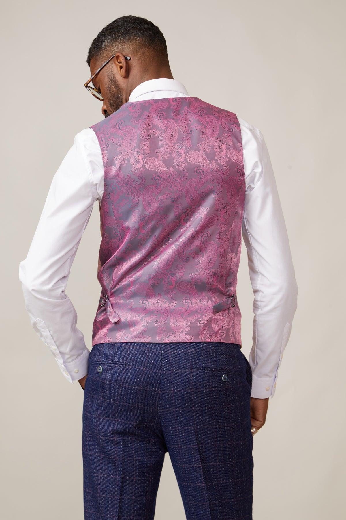 Back view of a man wearing a white shirt, blue plaid trousers, and the marcdarcy KELVIN pink double breasted waistcoat.