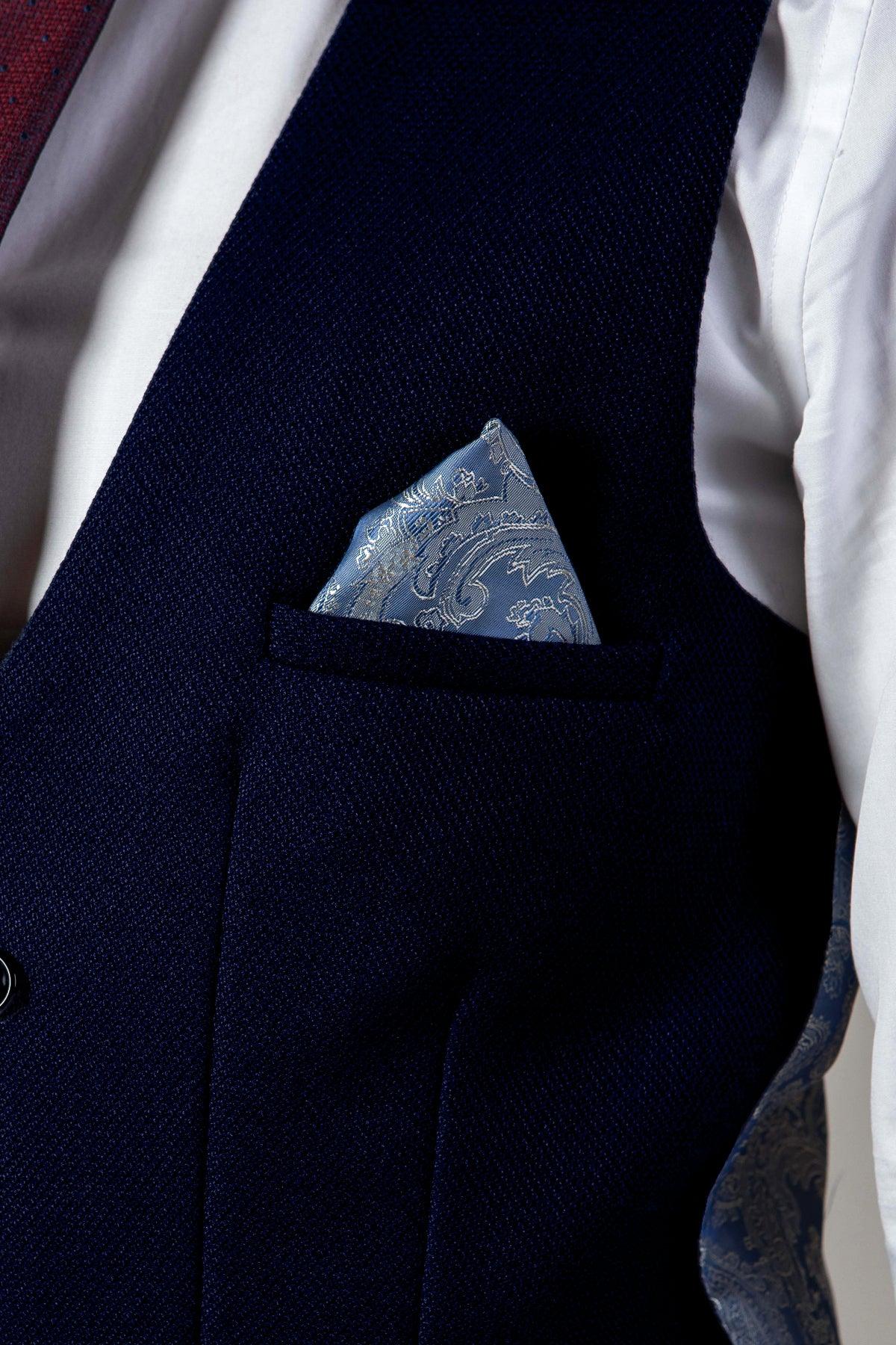 Close-up of the marcdarcy KELVIN navy double-breasted waistcoat in textured fabric, featuring a light blue paisley pocket square for stylish flair.