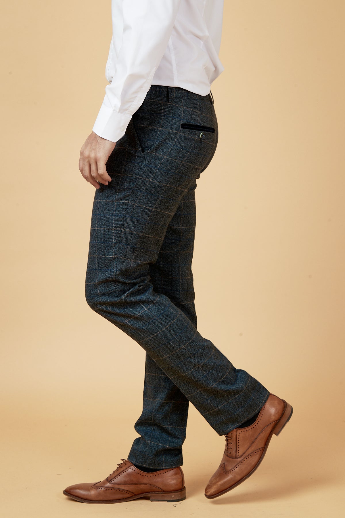 A person wearing the Marc Darcy SCOTT Blue Check Three Piece Suit stands against a beige background, shown from the shoulders down.