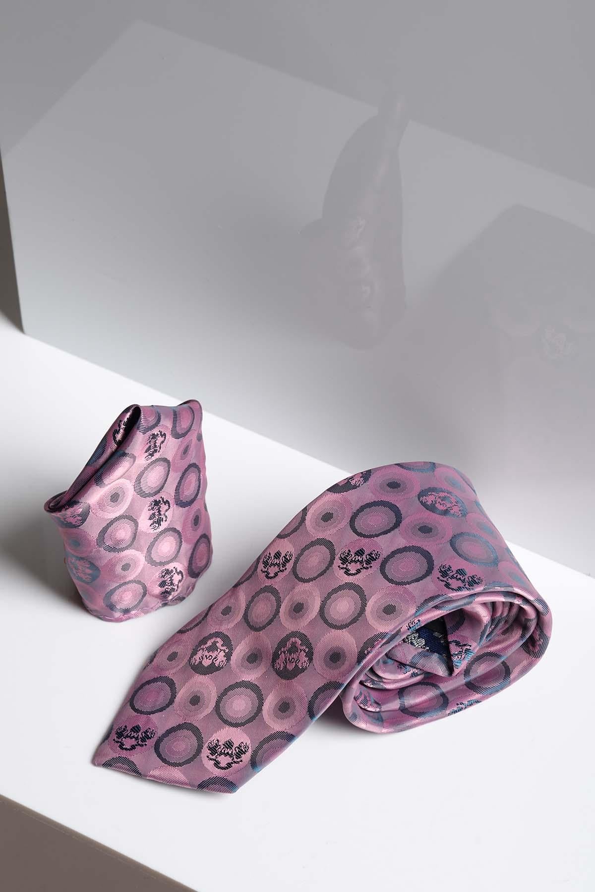The BUBBLES - Baby Pink Bubble Circle Print Tie and Pocket Square Set by Marc Darcy is shown on a white surface with a geometric gray background, highlighting its modern pastel pink design with subtle circle patterns.