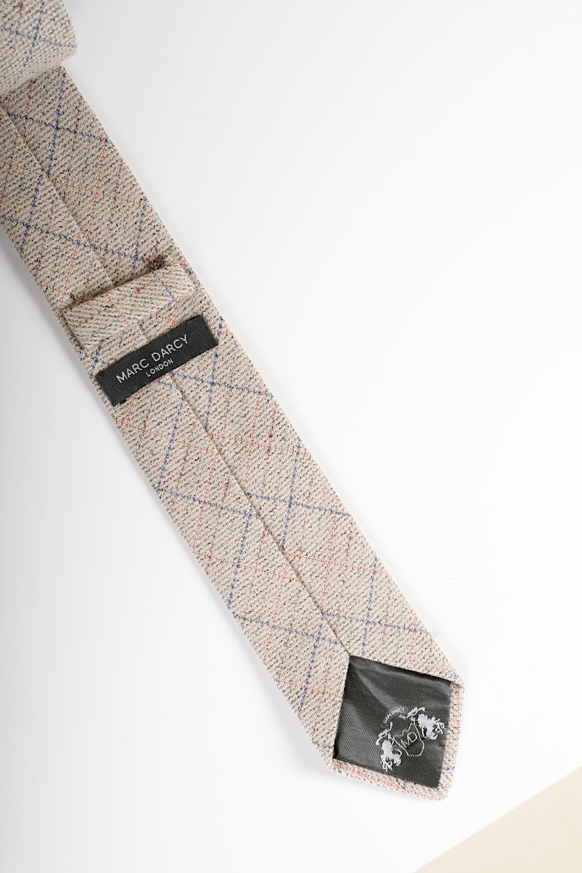 The Harding - Cream Tweed Check Tie by Accessory features a classic tweed texture with a subtle check pattern, offering refined charm and timeless style.