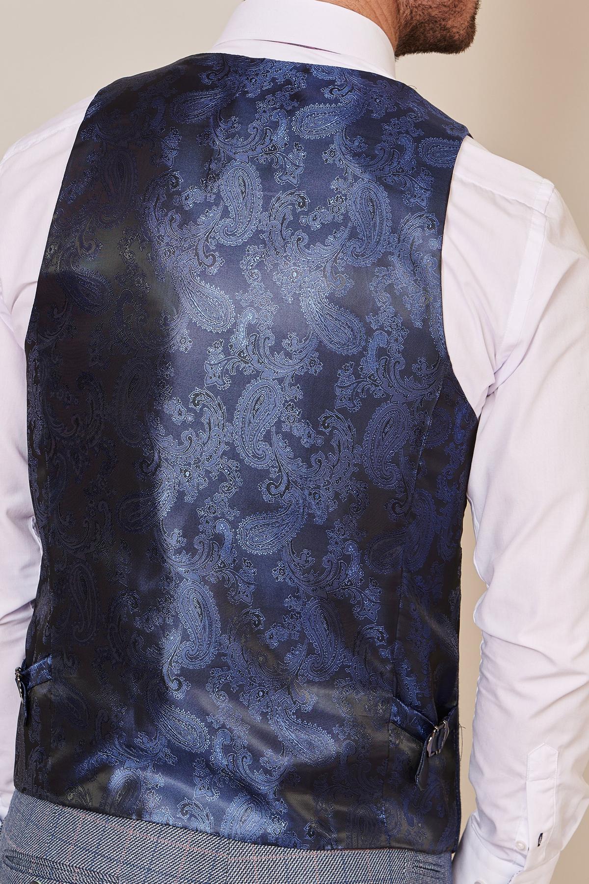 A person wearing a blush pink shirt and the marcdarcy HARRY Indigo Single Breasted Tweed Check Waistcoat, viewed from the back. The waistcoat features a blue check pattern, subtle sheen, and adjustable side straps—ideal for wedding attire.