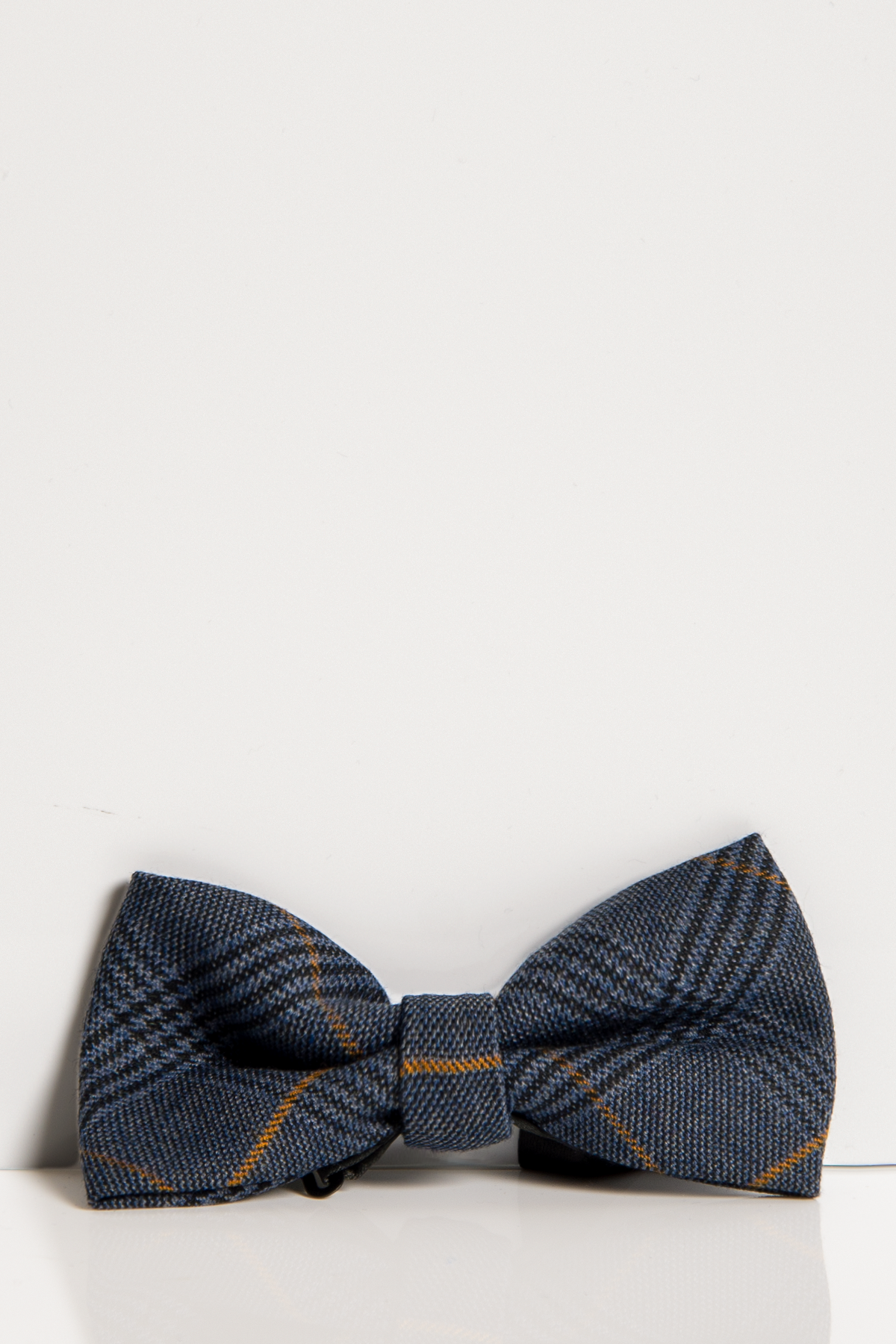 The Marc Darcy JENSON - MARINE NAVY CHECK BOW TIE features a pre-tied blue plaid design with subtle yellow and gray check lines, showcased against a plain white background.