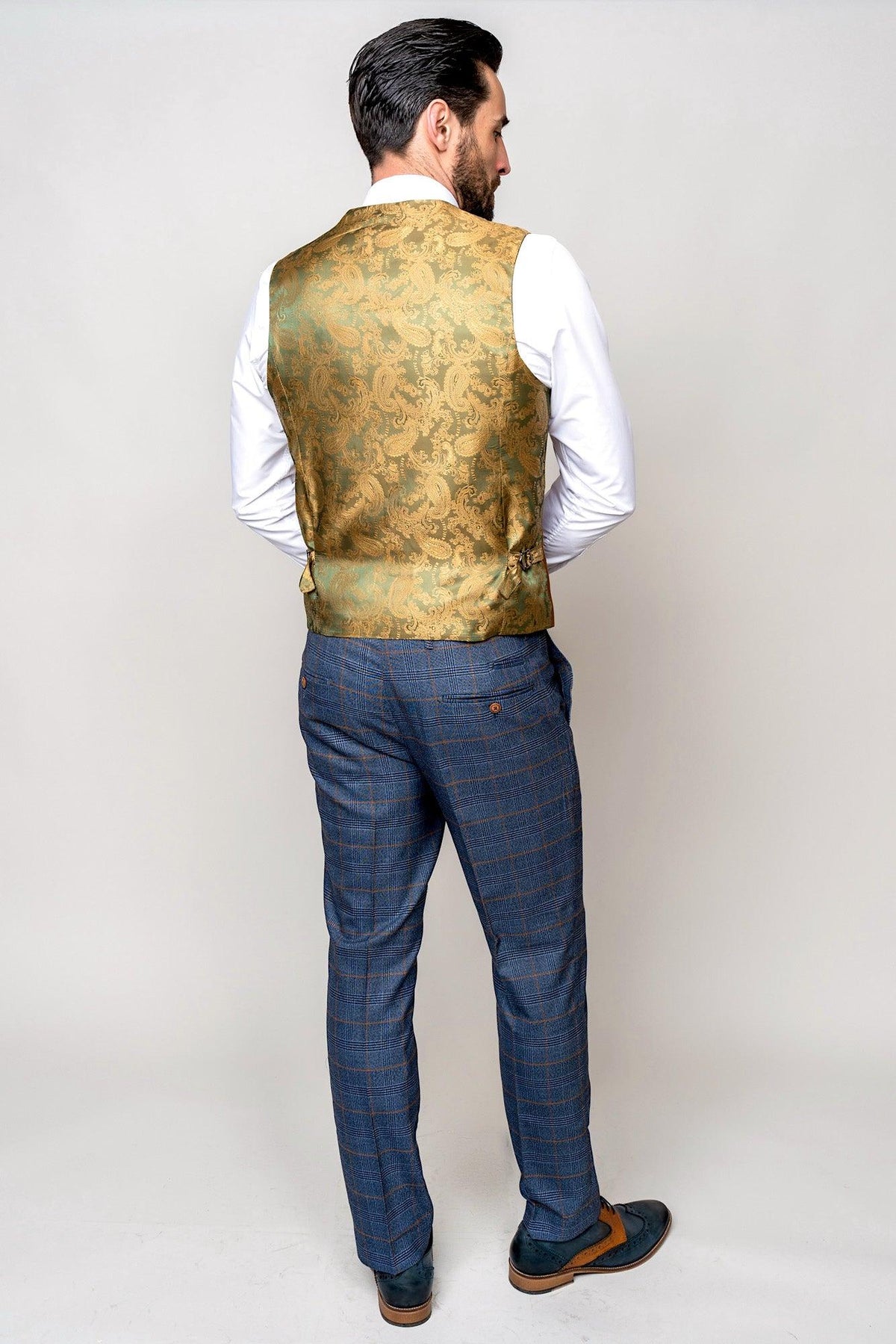 A man wears the marcdarcy JENSON Sky Blue Check Suit with a Kelvin Tan Waistcoat.