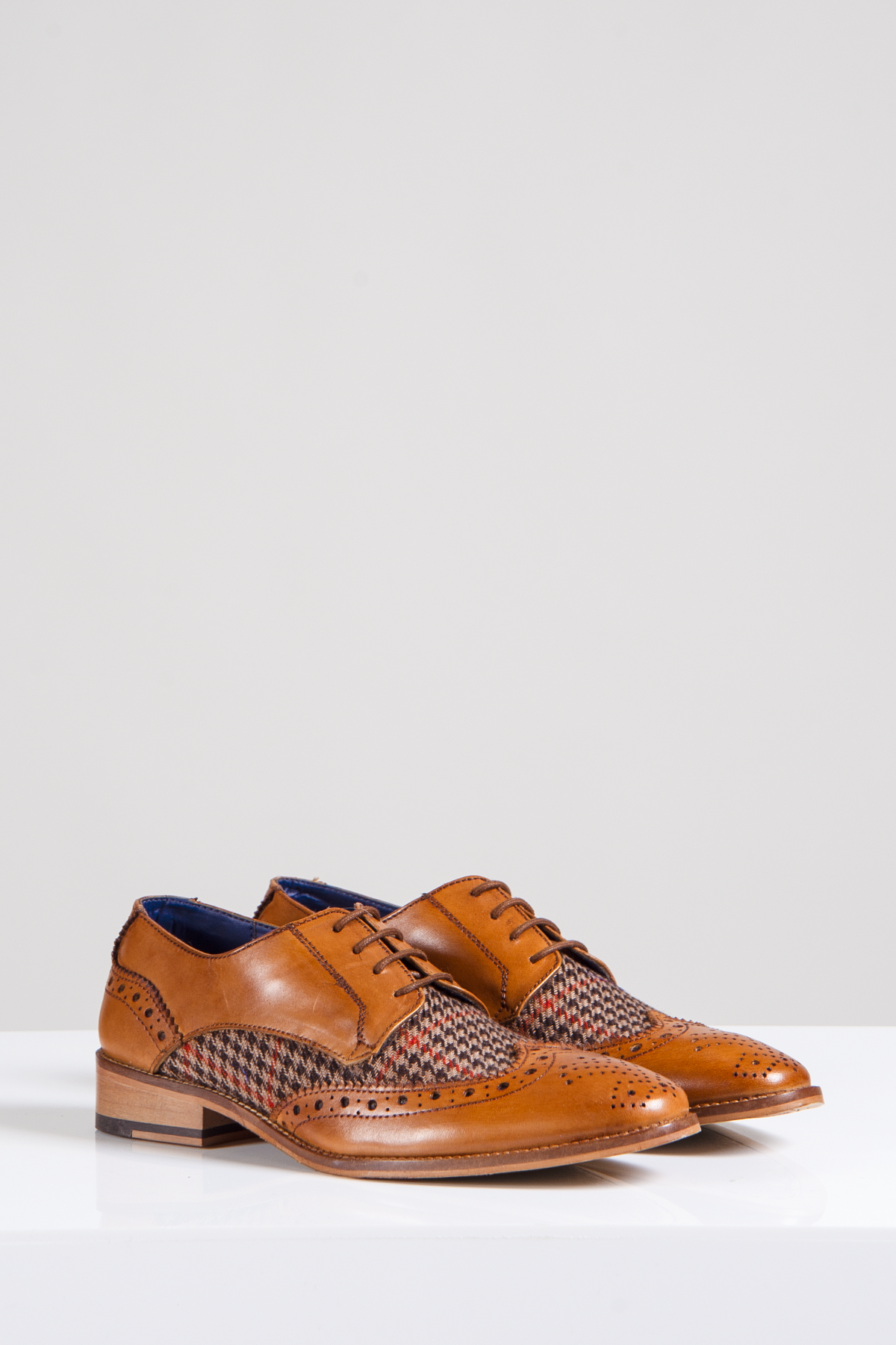 A pair of Marc Darcy JACOB Tan Leather Tweed Contrast Brogue Shoes with full grain leather, decorative perforations, and patterned tweed panels, displayed on a white surface against a light grey background.