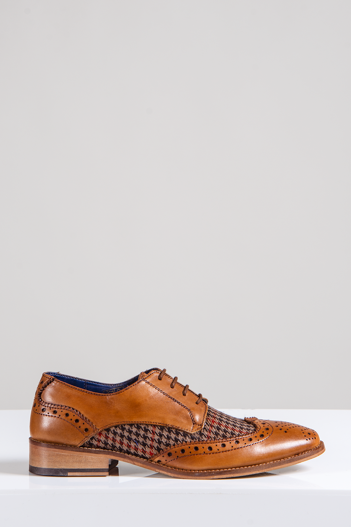 The JACOB - Tan Leather Tweed Contrast Brogue Shoe by Marc Darcy features full grain leather, tweed side panels, classic perforations, and a low wooden heel—ideal as grooms shoes—shown on a white surface with a light gray background.