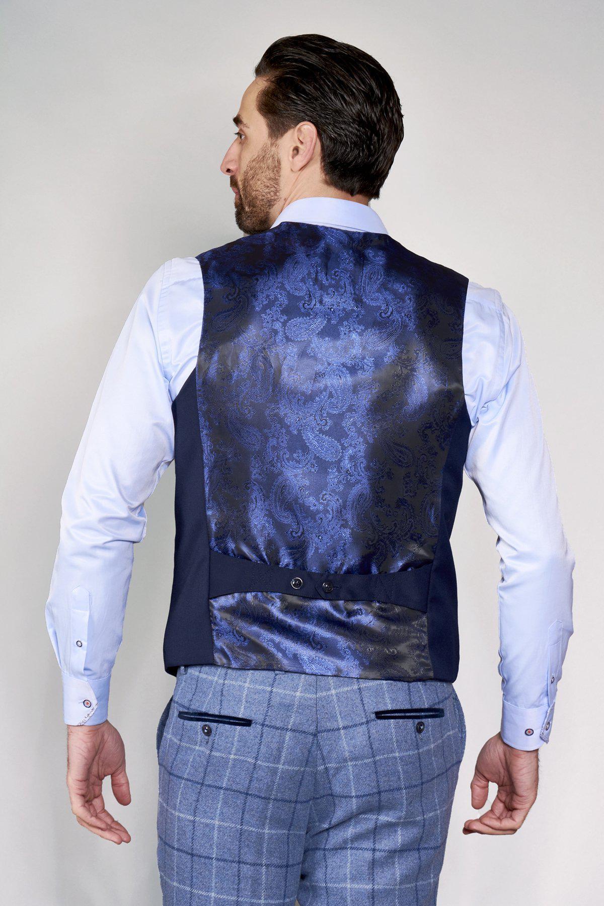 Man wearing a marcdarcy KELLY blue single breasted waistcoat and light blue dress shirt, seen from the back.
