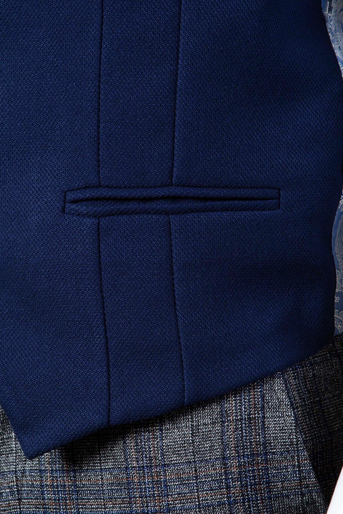 Close-up of the marcdarcy KELVIN Royal Blue Single Breasted Waistcoat styled with a dark blue suit jacket and grey plaid trousers for a refined, formal look.