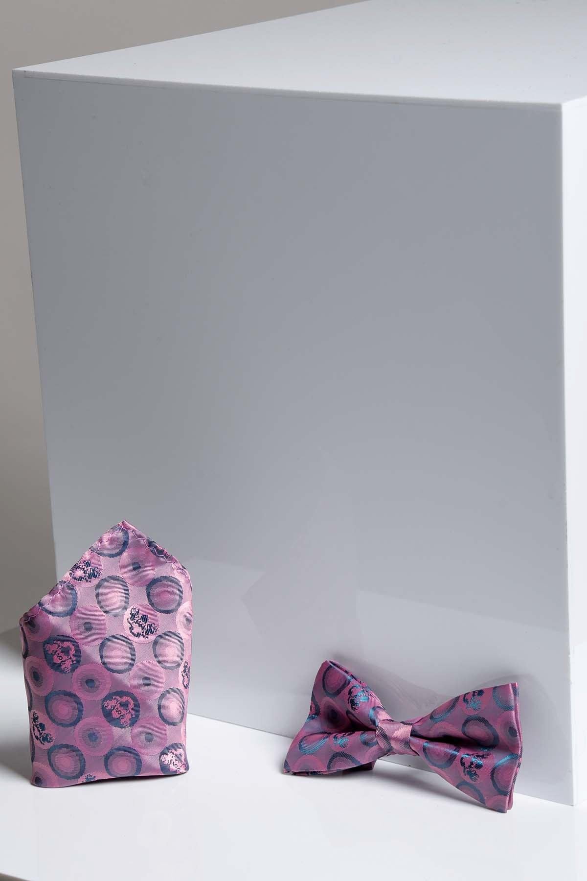 The Marc Darcy BUBBLES set features a baby pink bubble circle print pre-tied bow tie and matching pocket square, showcased on a glossy white geometric background.