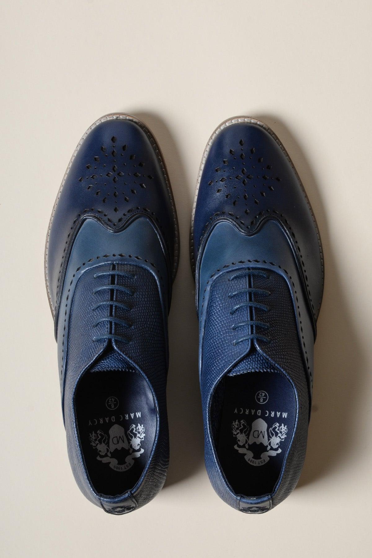 A pair of Marc Darcy RYAN Navy Blue Leather Wingtip Brogue Shoes with classic detailing and laces, displayed side by side on a light beige background.