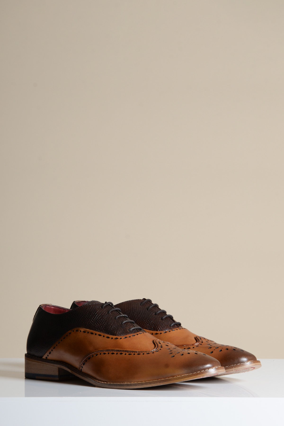 The Marc Darcy RYAN Tan Brown Leather Wingtip Brogue Shoes, featuring classic textured panels, are displayed on a white surface with a neutral background.