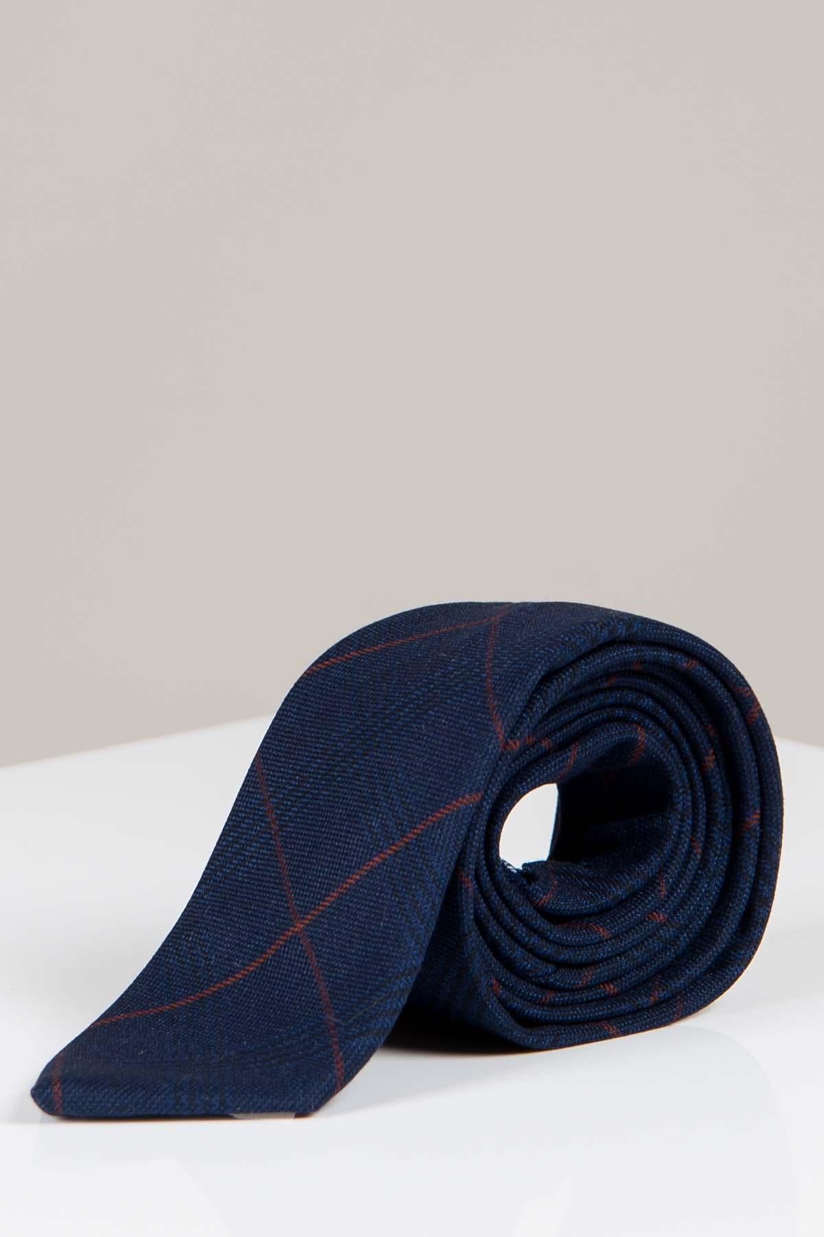 The Accessory EDINSON - Navy Wine Check Tie, featuring a subtle burgundy check pattern, is neatly rolled and displayed on a white surface with a neutral background.