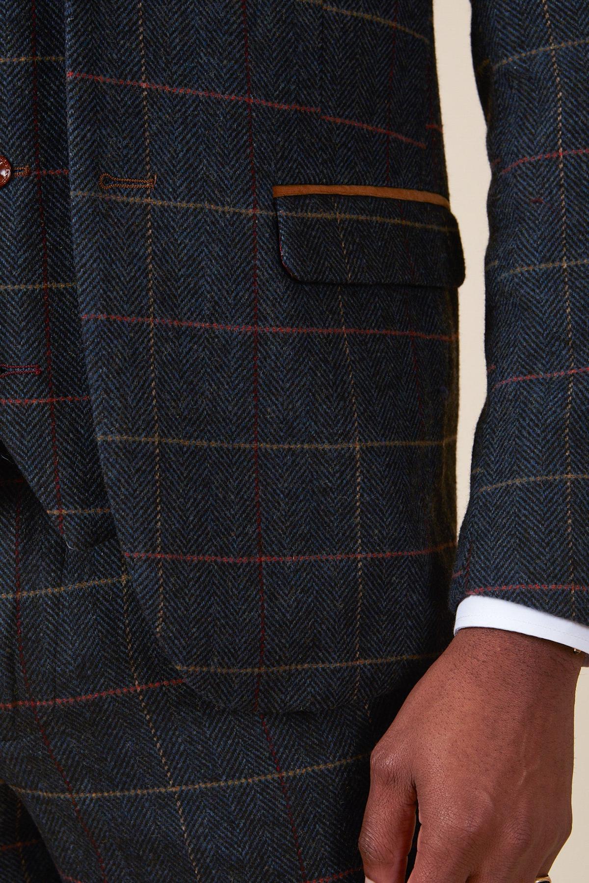 A close-up of a person in the marcdarcy ETON Navy Blue Tweed Check Blazer, styled with a white shirt cuff—an ideal smart casual look.