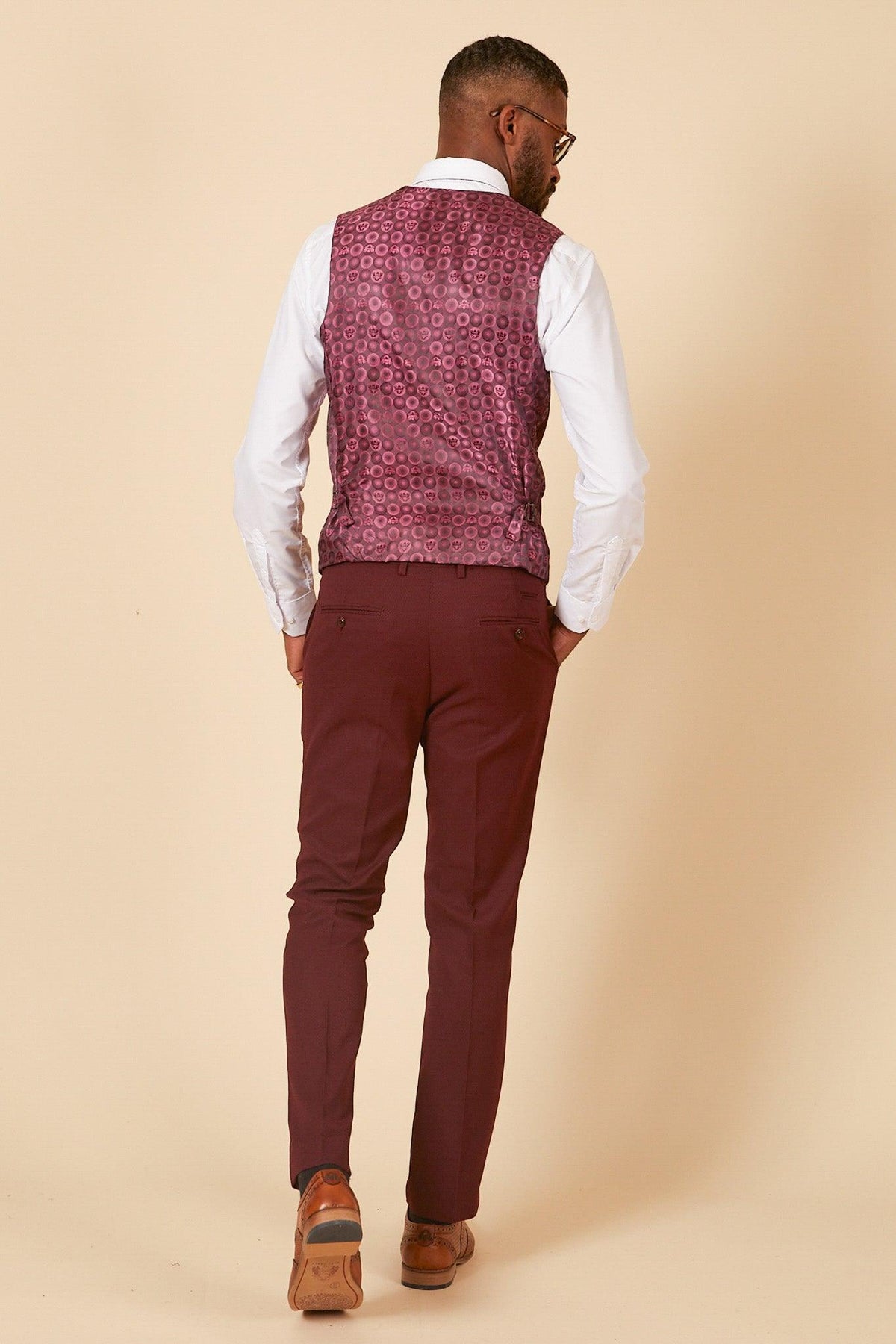 Man from behind wearing a white shirt, marcdarcy MAX Wine Single Breasted Waistcoat with matching burgundy pants and brown dress shoes—ideal for a stylish wedding guest look.