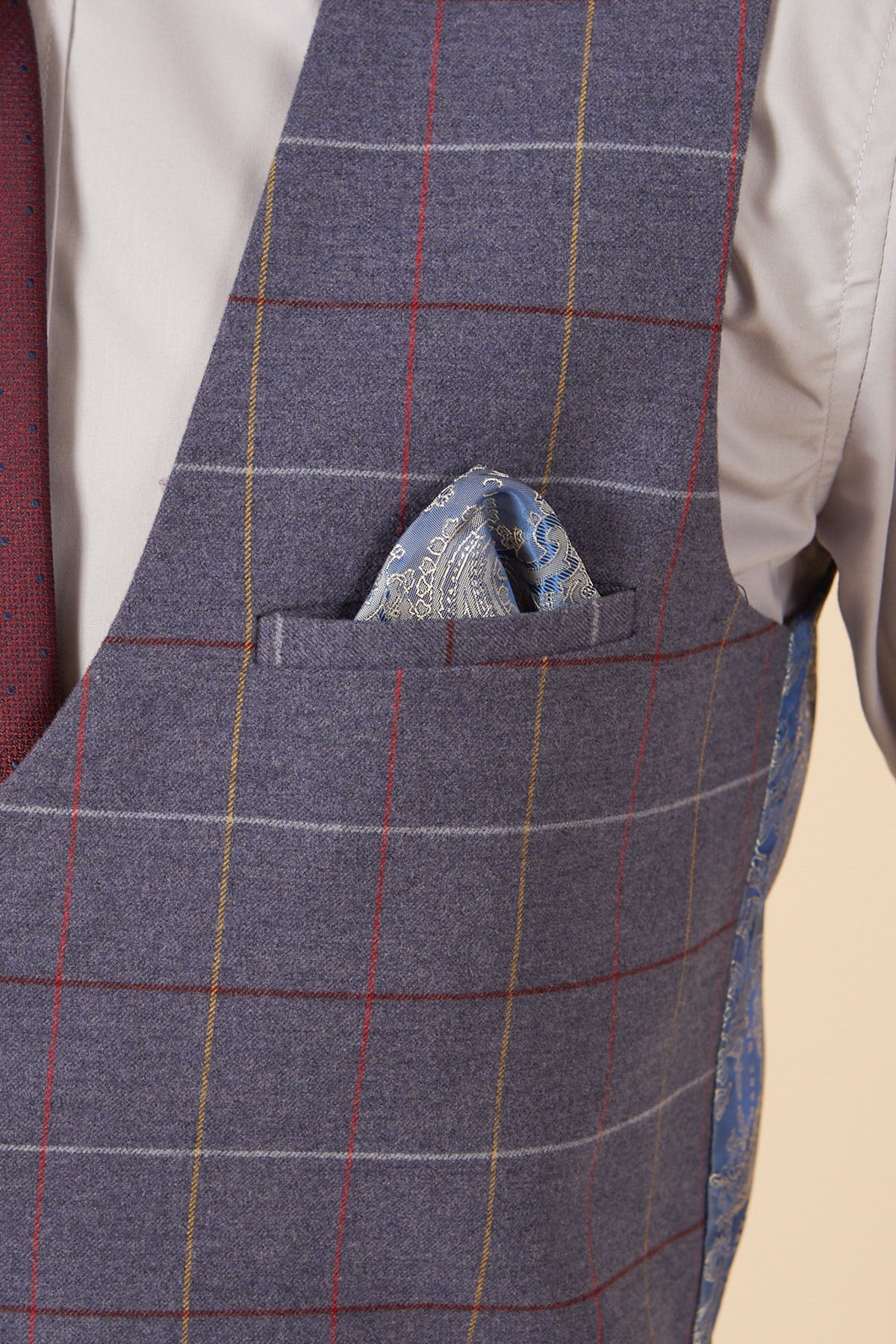 A close-up of the marcdarcy DRAKE - Sky Blue Check Three Piece Suit, styled with a blue paisley pocket square—ideal for pairing with a slim fit look at any formal event.