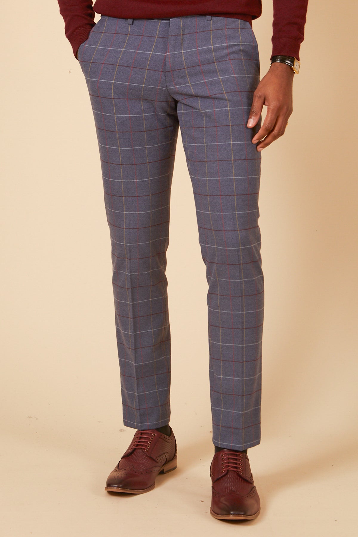 Dressed in the marcdarcy DRAKE - Sky Blue Check Three Piece Suit, this individual stands hands-in-pockets against a neutral background, highlighting a sophisticated look ideal for formal occasions.