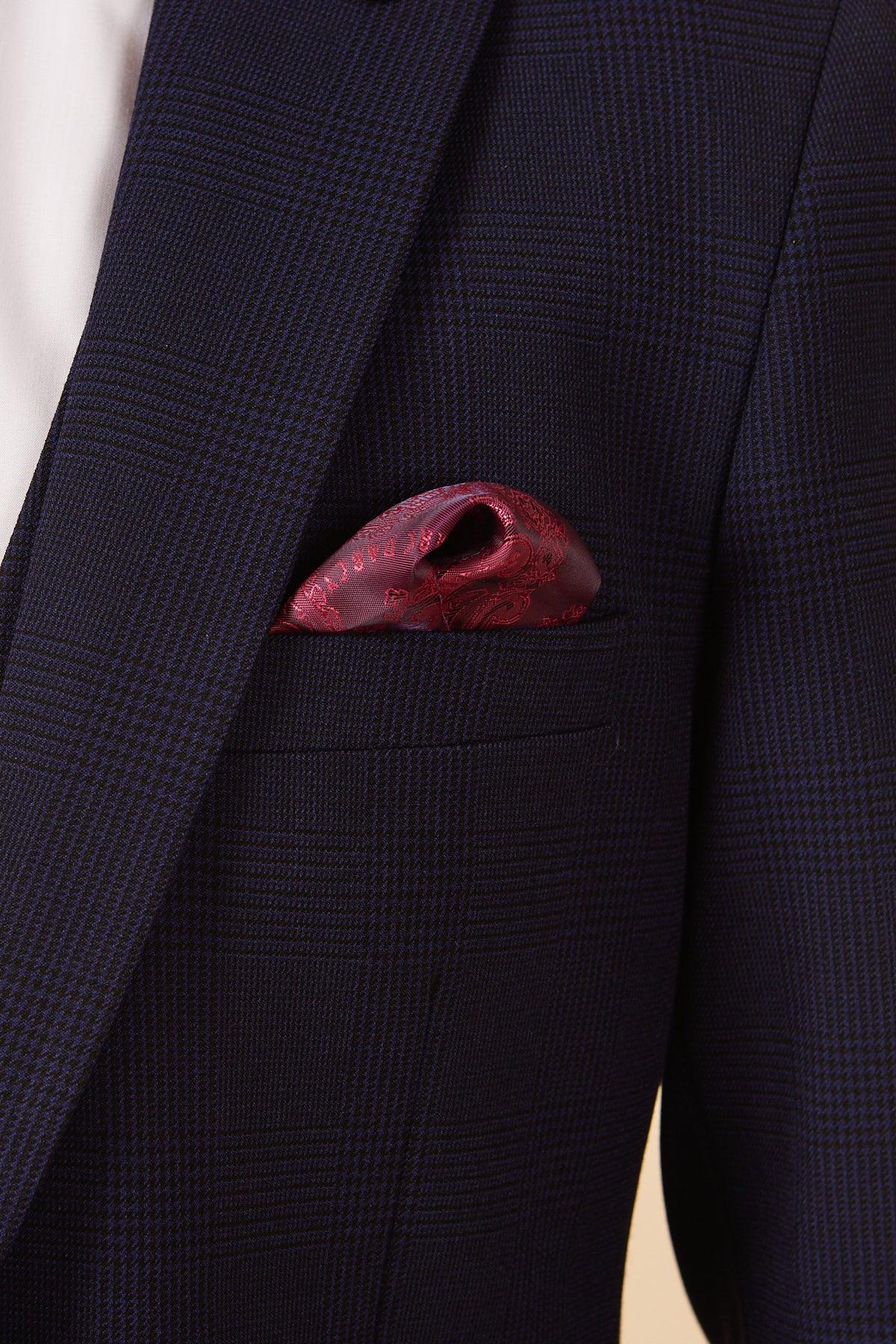 Close-up of a man wearing the Marc Darcy BROMLEY Navy Check Two Piece Suit, featuring a rich burgundy paisley pocket square in the breast pocket.
