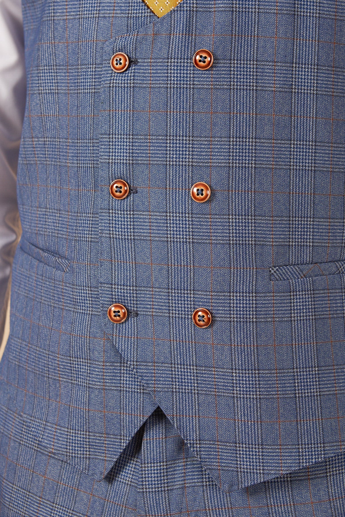 Close-up of the marcdarcy GEORGE - Light Blue Check Three Piece Suit vest, double-breasted with six brown buttons, two pockets, and a glimpse of a yellow tie and white shirt at the top.