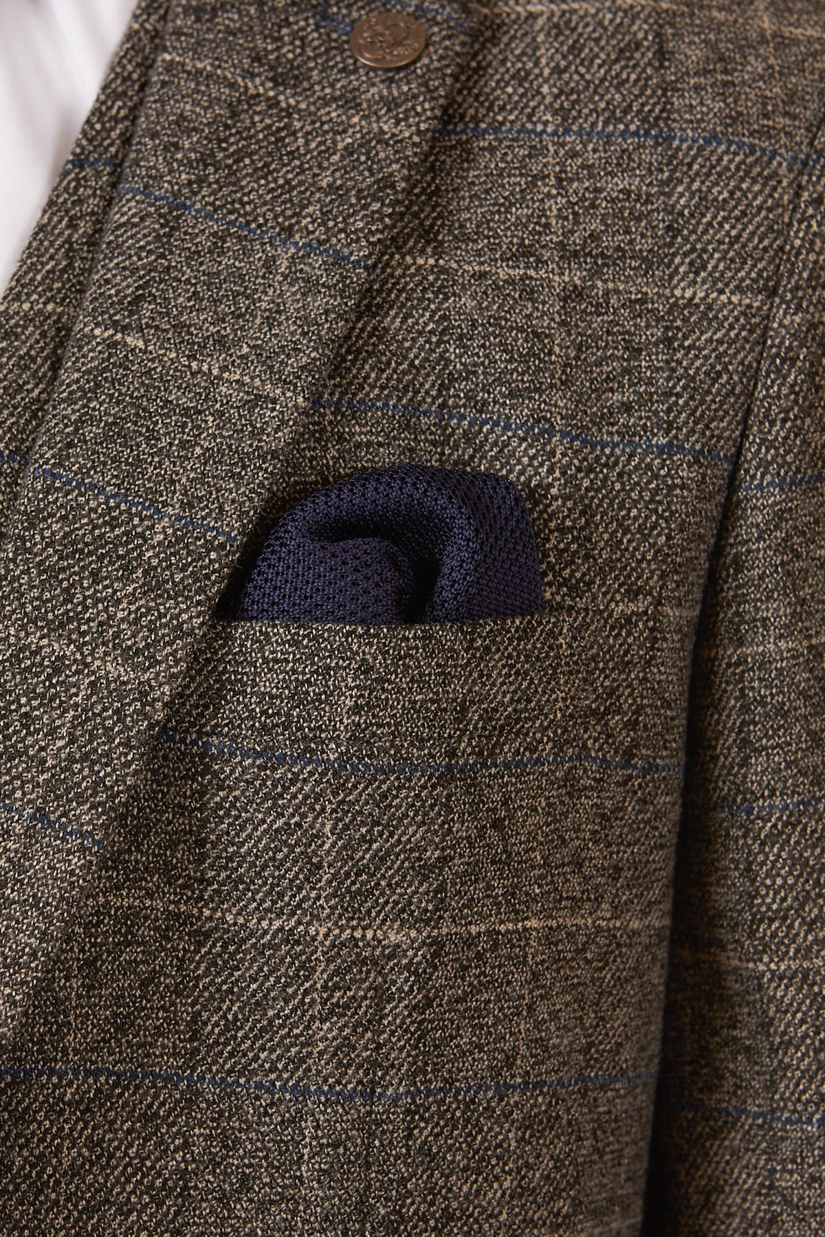 Close-up of the marcdarcy SCOTT Grey Tweed Check Blazer, featuring a subtle check pattern, navy velvet trims, and a neatly placed navy blue pocket square in the chest pocket.
