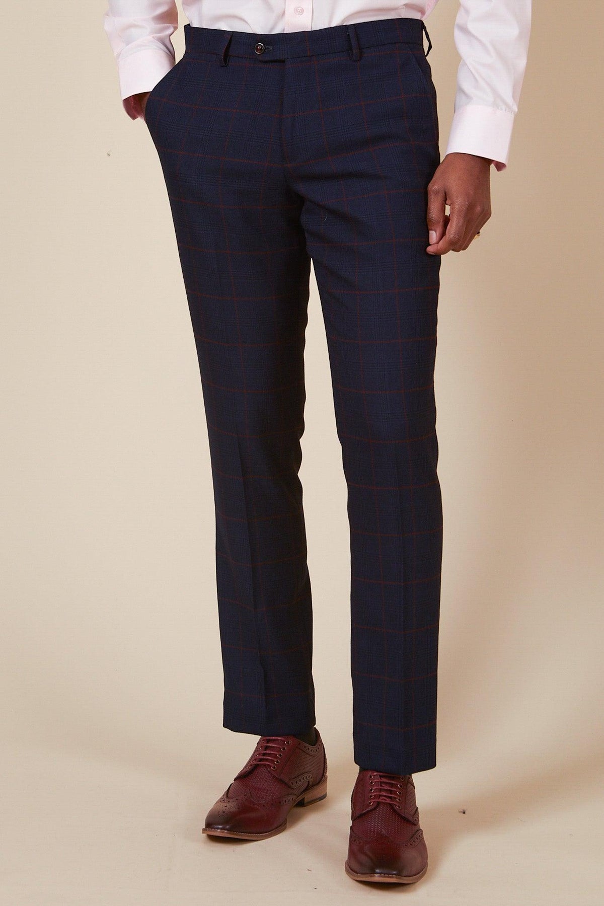 Close up of a man wearing the Marc Darcy EDINSON Navy Wine Check Two Piece Suit, paired with burgundy dress shoes.