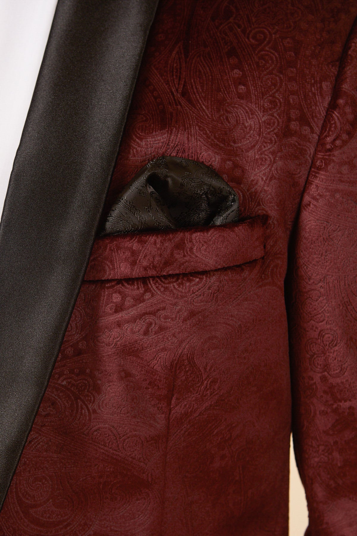 The SIMON Wine Velvet Jacquard Three Piece Suit by Marc Darcy features a rich burgundy paisley design, black satin lapel, and sleek pocket square—ideal party wear for any stylish occasion.
