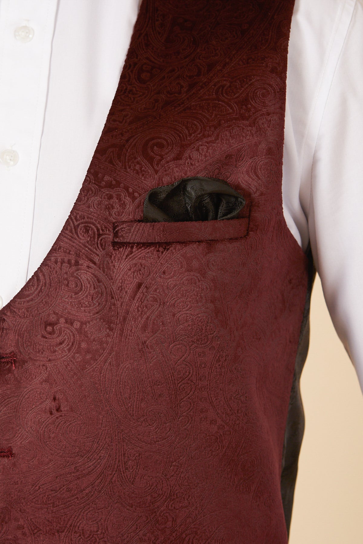 Close-up of a person wearing the SIMON - Wine Velvet Jacquard Three Piece Suit by Marc Darcy, styled with a black pocket square—perfect party wear to elevate any tuxedo suit ensemble.