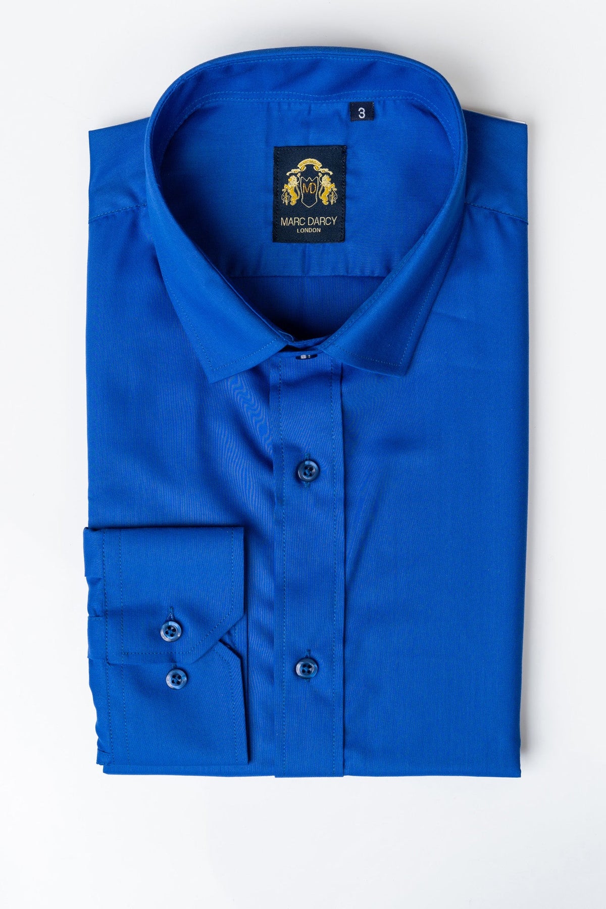 The CARTER - Royal Long Sleeve Shirt by Marc Darcy, featuring a classic collar and buttoned cuffs, is neatly folded and displayed against a plain white background.