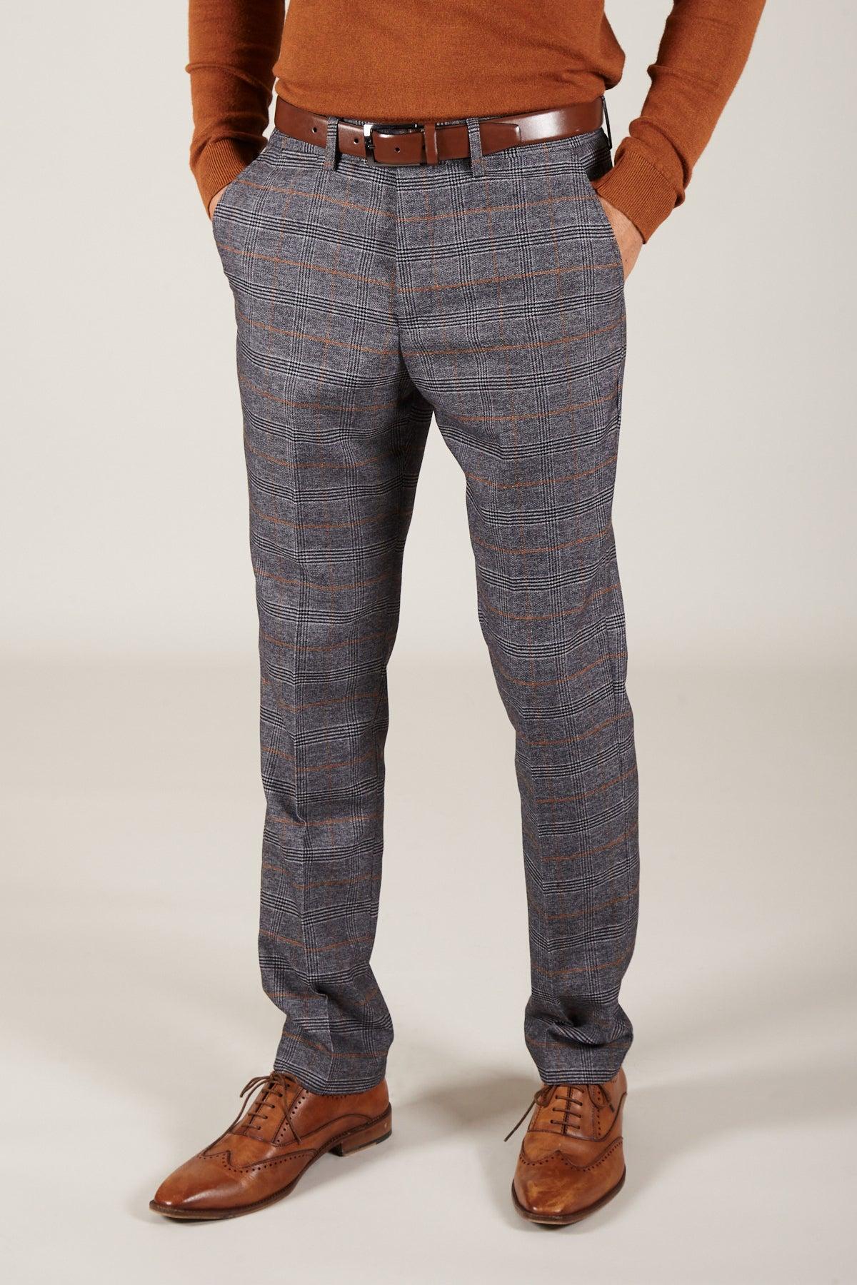 Close up of a man wearing marcdarcy’s JENSON Grey Check Suit paired with the KELVIN Tan Waistcoat for a polished, sophisticated look.