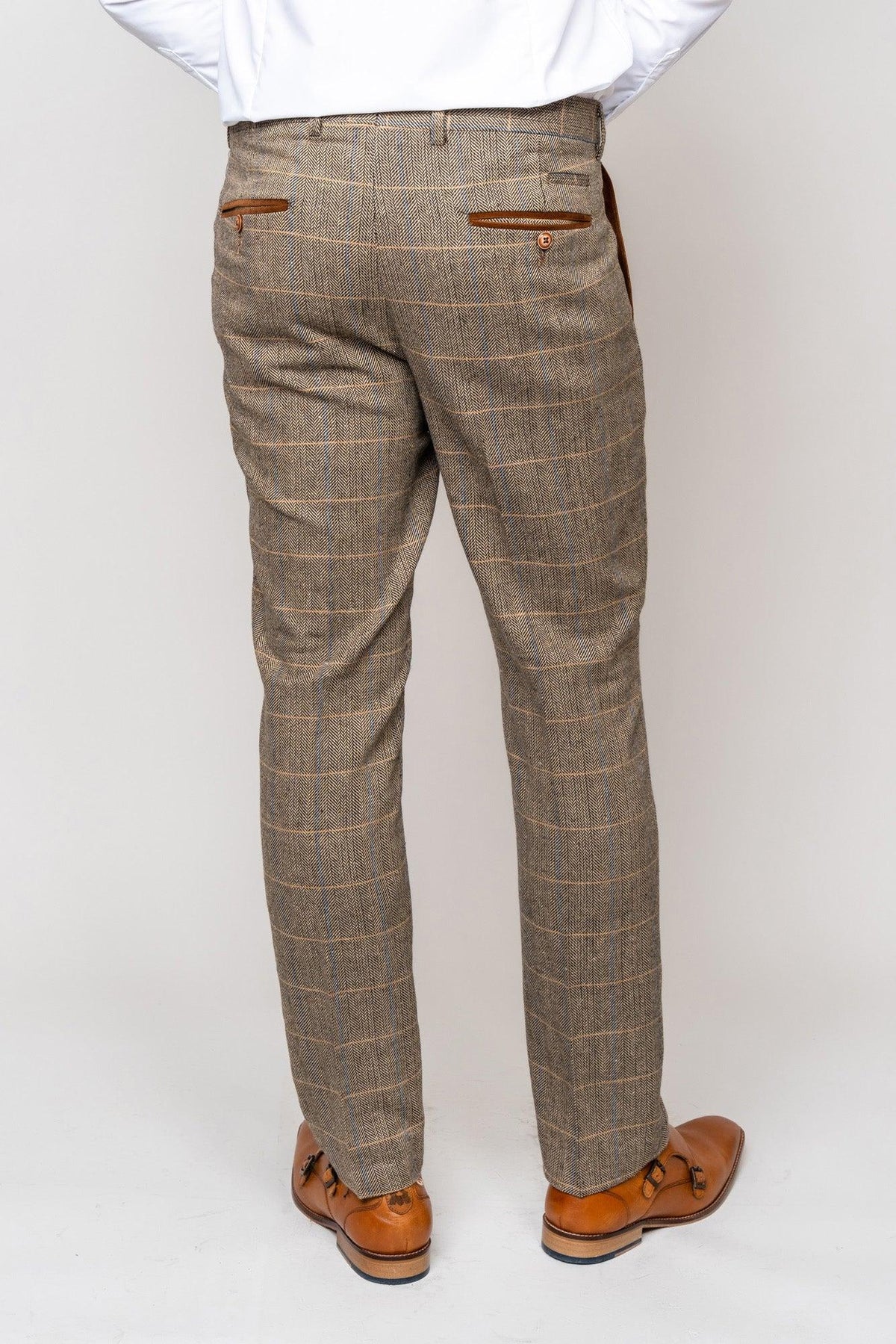 A person in the marcdarcy TED Tan Tweed Check Suit with Kelvin Tan Waistcoat stands with their back to the camera against a plain light background—ideal for a country barn wedding or paired with classic accessories.