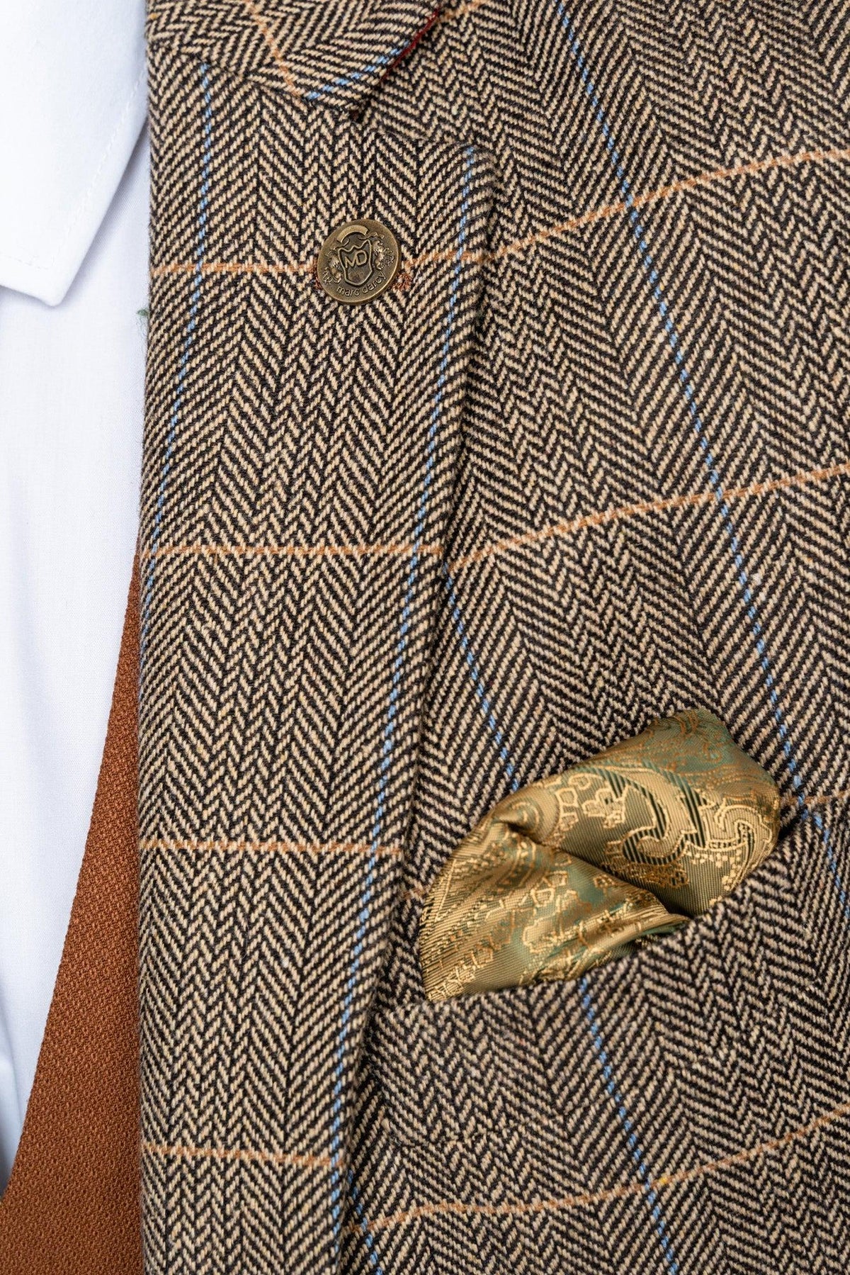 Close-up of the marcdarcy TED Tan Tweed Check Suit with Kelvin Tan Waistcoat, featuring a gold button, patterned gold pocket square, and brown tie over a white shirt—a refined choice for a country barn wedding.