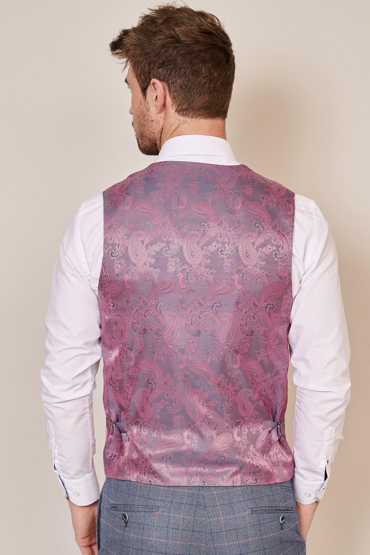 A man with short brown hair is seen from behind wearing the marcdarcy KELVIN - Pink Single Breasted Waistcoat, a white dress shirt, and gray plaid trousers against a plain beige background.