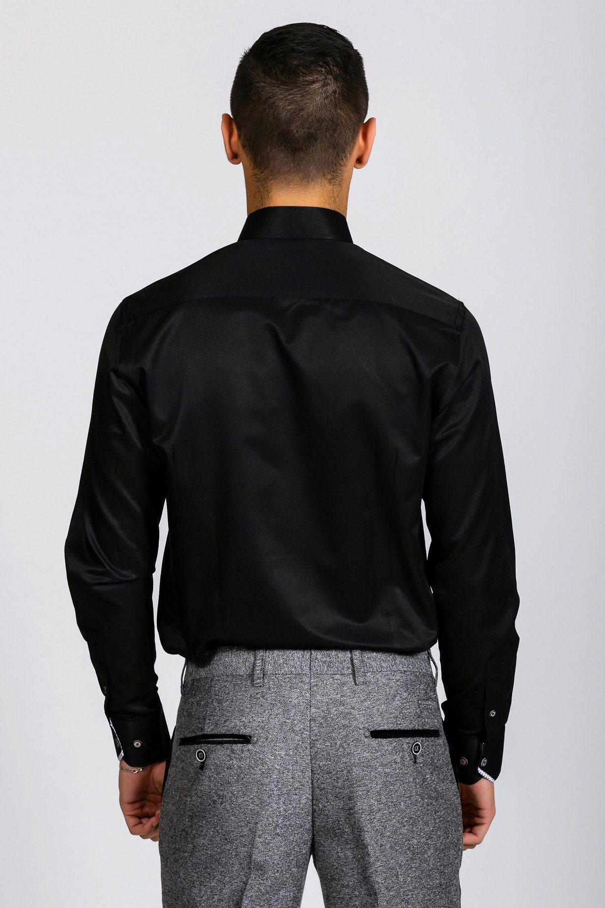 A man is seen from behind wearing the Marc Darcy ALFIE black long sleeve shirt with gray dress pants, featuring black buttoned back pockets, standing against a plain light background for a polished look.