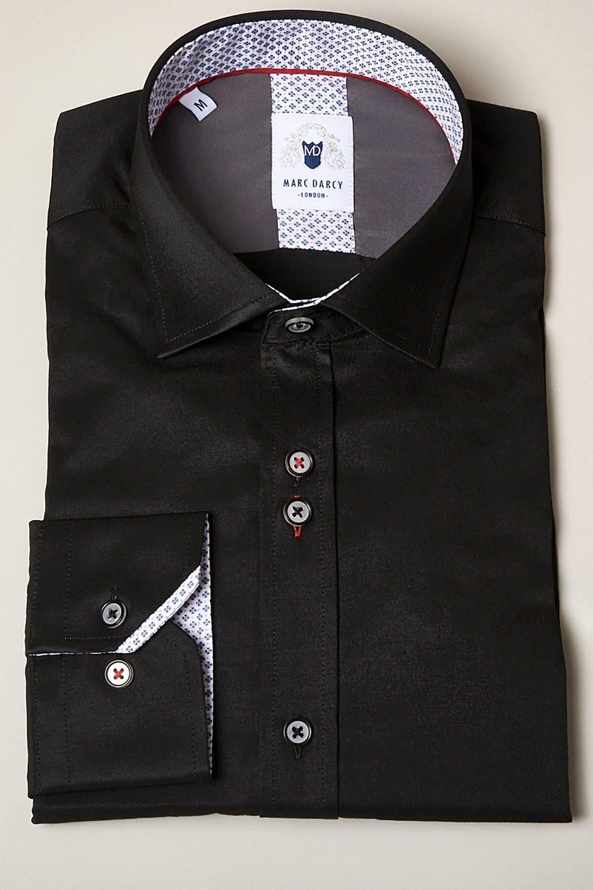 The ALFIE Black Long Sleeve Shirt by Marc Darcy features a sheen finish, contrasting white and patterned inner collar and cuffs, black buttons, and an embroidered Marc Darcy label inside the collar.