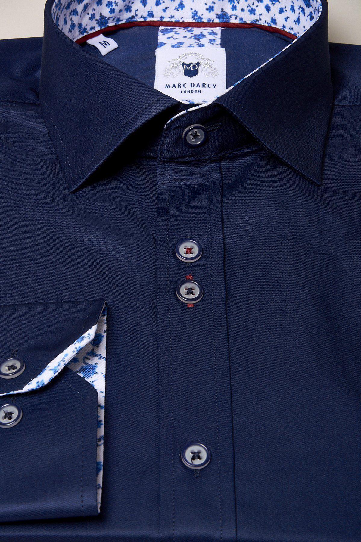 A close-up of the Marc Darcy ALFIE navy long sleeve shirt, showcasing its white floral print lining on the collar and cuffs.