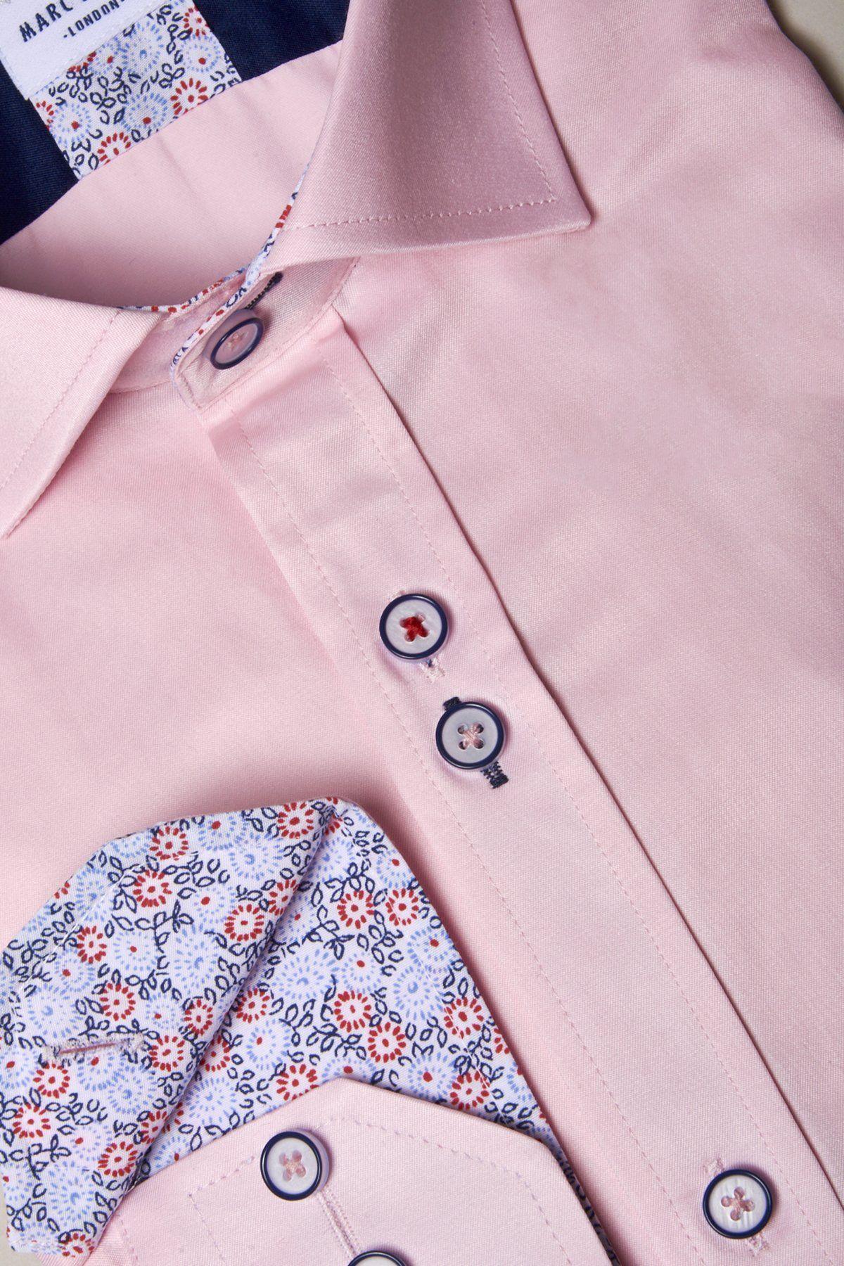 Close-up of the ALFIE Pink Long Sleeve Shirt by Marc Darcy, featuring floral detailing on the inner collar and cuffs, with navy and red button accents.
