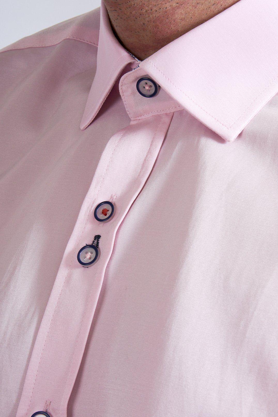 Close-up of a person wearing the Marc Darcy ALFIE Pink Long Sleeve Shirt with classic fit, featuring a smooth, slightly shiny fabric, visible collar, and several buttons.