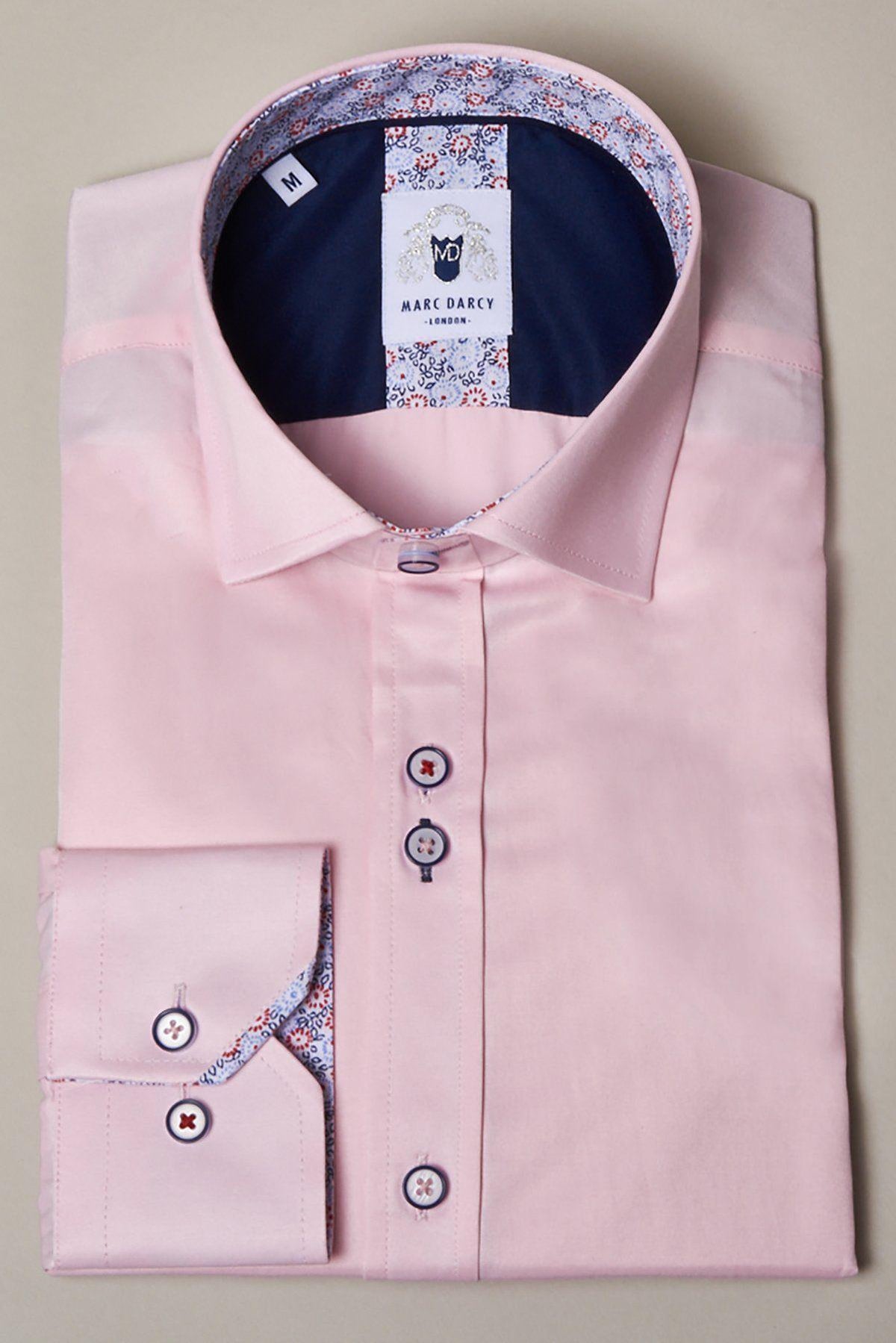 The ALFIE Pink Long Sleeve Shirt by Marc Darcy has a classic fit, contrasting floral detail inside the collar and cuffs, dark navy buttons with red accents, and a Marc Darcy label on the inner collar.