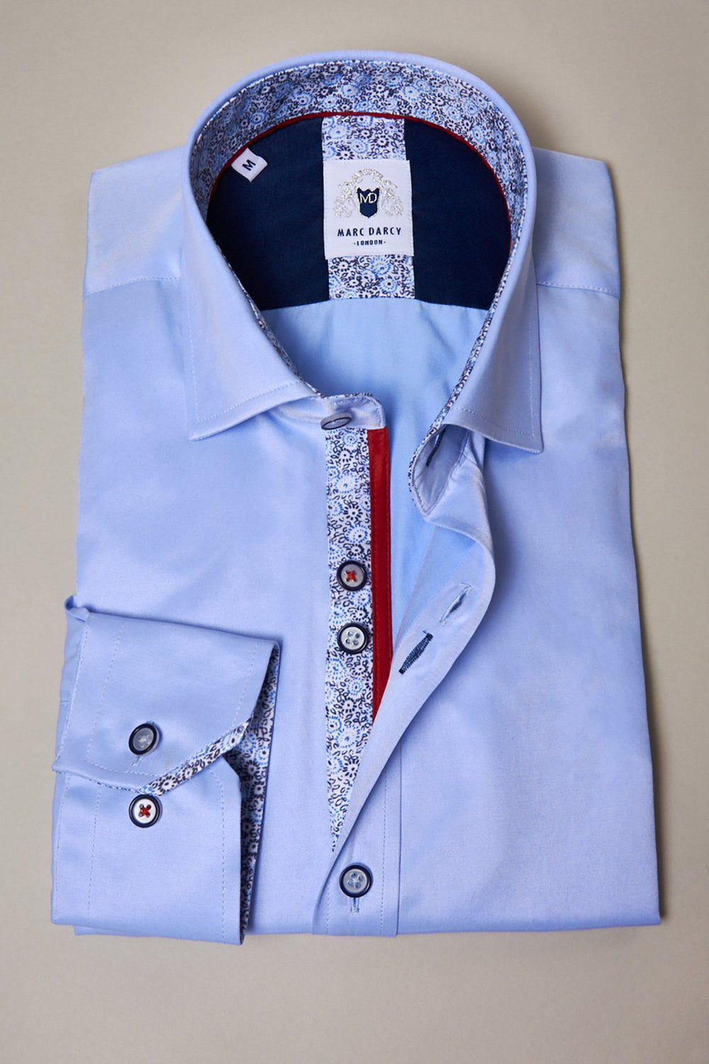 The ALFIE - Sky Blue Long Sleeve Shirt by Marc Darcy features patterned trim on the collar and cuffs, contrasting buttons, and an inner collar label—an ideal choice for smart office wear.