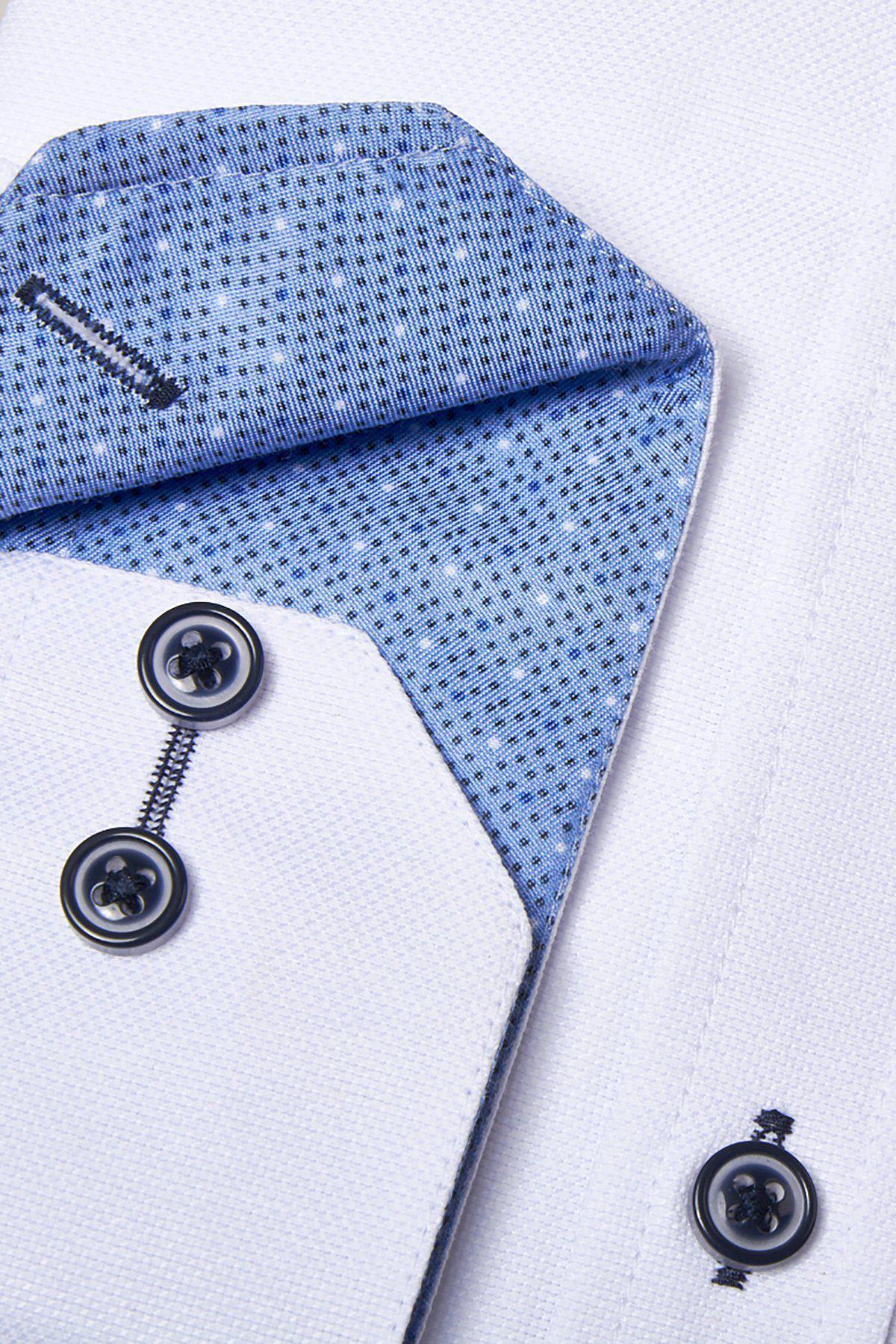Close-up of the ARCHIE White Grandad Collar Shirt by Marc Darcy, featuring a crisp oxford weave, blue textured inner placket, striking navy buttons, and dark stitching details that contrast with the clean white fabric.