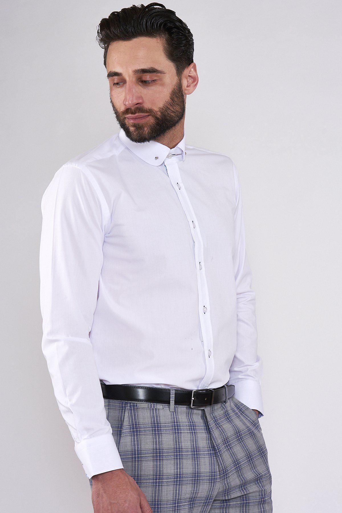 A man with a beard wears the marcdarcy BENSON White Penny Collar Shirt With Collar Bar and grey plaid pants with a black belt.