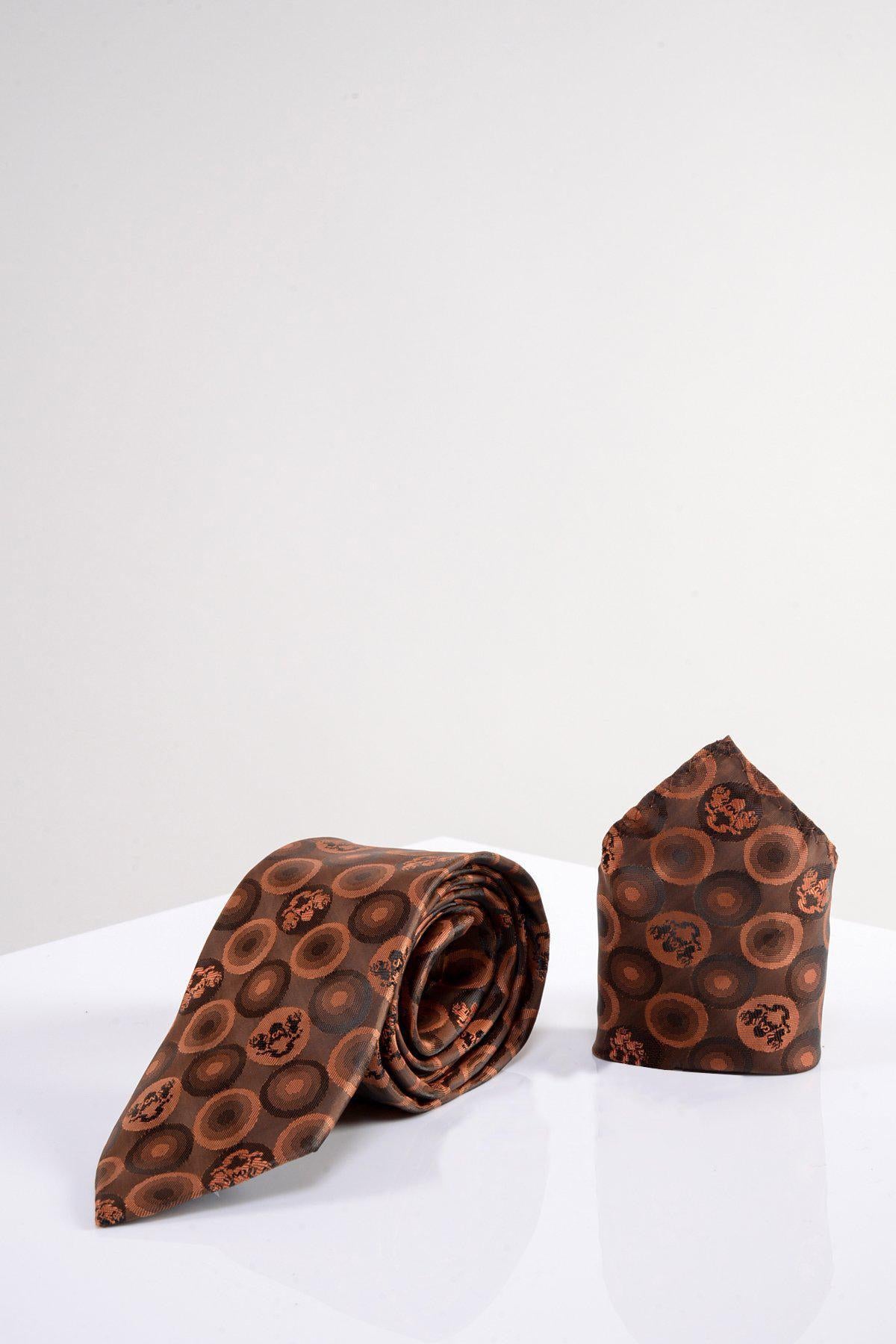 The Marc Darcy BUBBLES Orange Brown Bubble Circle Print Tie and Pocket Square Set features orange circular and floral patterns, displayed on a white surface with a light background. This multi-tonal set adds elegance to any look.