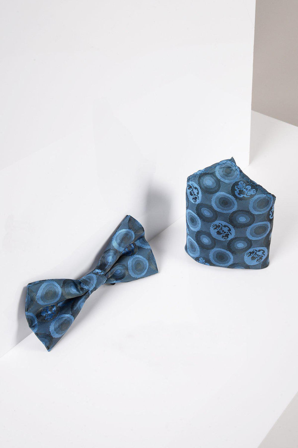 The Marc Darcy BUBBLES - Sky Teal Bubble Circle Print Bow Tie and Pocket Square Set is elegantly displayed on a white surface.