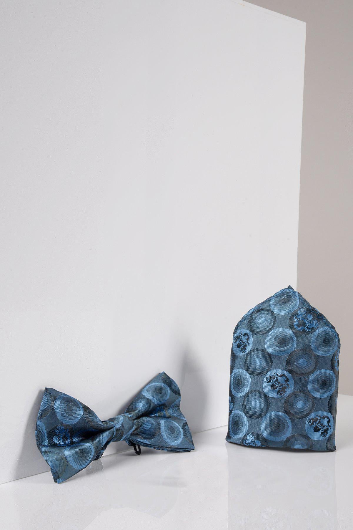 The Marc Darcy BUBBLES - Sky Teal Bubble Circle Print Bow Tie and Pocket Square Set is displayed elegantly on a white surface.