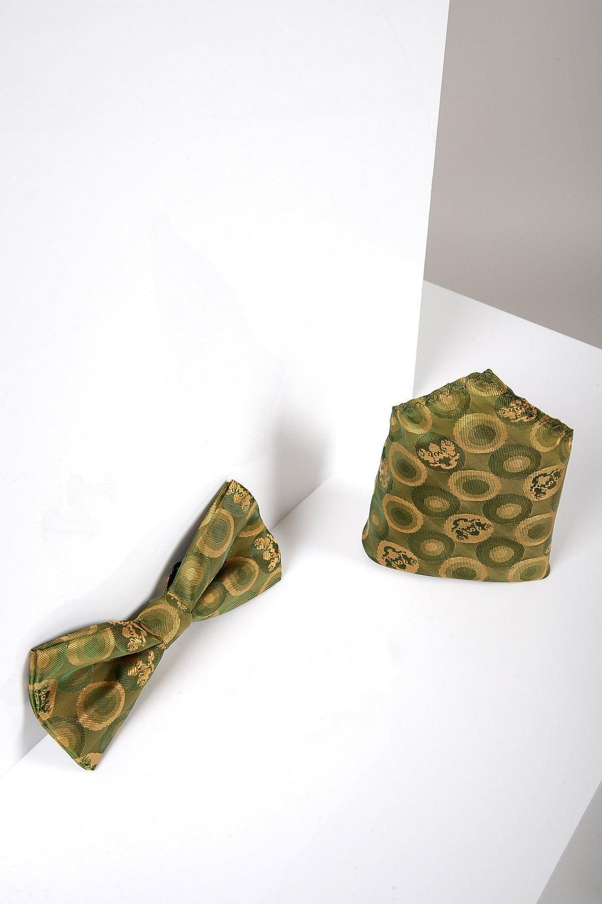 The Marc Darcy BUBBLES - Tan Bubble Circle Print Bow Tie and Pocket Square Set features a tan fabric with yellow and black bubble patterns, displayed on a white and gray geometric background.