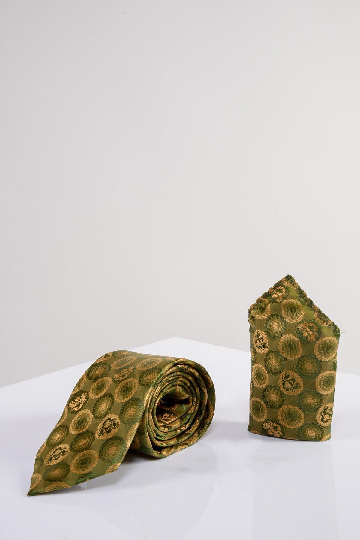 The Marc Darcy BUBBLES - Tan Bubble Circle Print Tie and Pocket Square Set features a tan tie and matching accessory with a bubble circle print, displayed on a white surface against a plain light background.